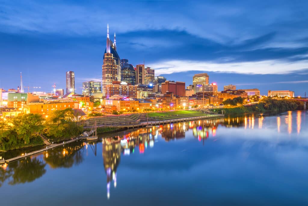 Nashville, Tennessee, USA skyline on the Cumberland River at night. Floors in Tennessee